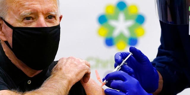 President-elect Joe Biden receives his second dose of the coronavirus vaccine at ChristianaCare Christiana Hospital in Newark, Delaware on Monday, January 11, 2021. The vaccine is administered by Chief Nurse Ric Cuming.  (AP Photo / Susan Walsh)