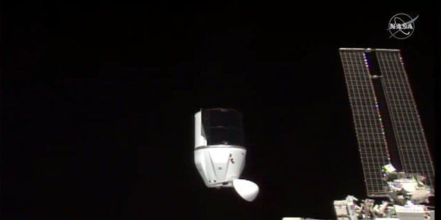 This photo provided by NASA shows SpaceX's Dragon undocking from International Space Station on Tuesday, Jan. 12, 2021. (NASA via AP)