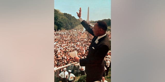 Martin Luther King Jr. waving to the crowd at the Lincoln Memorial for his "I Have a Dream" speech on Aug. 28, 1963.