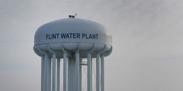 The Flint Water Plant tower is shown in Flint, Mich., Some Flint residents impacted by months of lead-tainted water are looking past expected charges against former Gov. Rick Snyder and others in his administration to healing physical and emotional damages left by the crisis. (AP Photo/Paul Sancya)