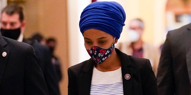 Rep. Ilhan Omar, D-Minn., walks to the House chamber on Capitol Hill in Washington, Wednesday, Jan. 13, 2021. (AP Photo/Susan Walsh)