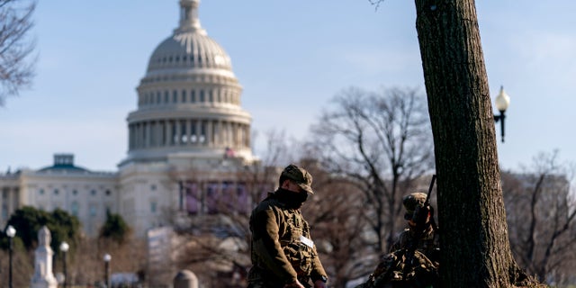 Members of the National Guard work outside the U.S Capitol building on Capitol Hill in Washington, Thursday, Jan. 14, 2021. (AP Photo/Andrew Harnik)