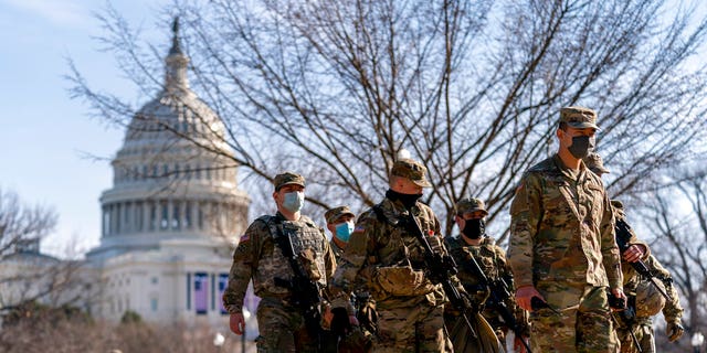Members of the National Guard patrol the Capitol Hill on Capitol Hill in Washington, Thursday, January 14, 2021 (Associated Press)