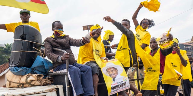 Supporters of Ugandan President Yoweri Kaguta Museveni celebrate in Kampala, Uganda, Saturday Jan. 16, 2021, after their candidate was declared winner of the presidential elections. Uganda’s electoral commission says longtime President Yoweri Museveni has won a sixth term, while top opposition challenger Bobi Wine alleges rigging and officials struggle to explain how polling results were compiled amid an internet blackout. In a generational clash widely watched across the African continent, the young singer-turned-lawmaker Wine posed arguably the greatest challenge yet to Museveni. (AP Photo/Jerome Delay)