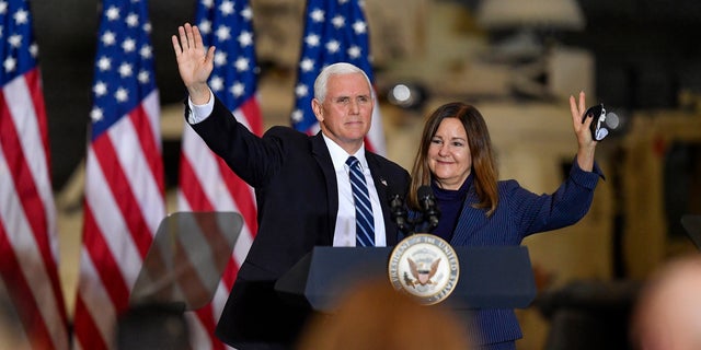 Vice President Mike Pence, left, and second lady Karen Pence waving after remarks to Army 10th Mountain Division soldiers, many of whom recently returned from Afghanistan, in Fort Drum, New York, Jan. 17, 2021.
