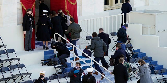 People evacuate from the West Front of the U.S. Capitol during a rehearsal the 59th Presidential Inauguration at the U.S. Capitol in Washington, Monday, Jan. 18, 2021. (AP Photo/Carolyn Kaster)