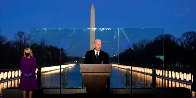 President-elect Joe Biden speaks at a COVID-19 memorial, with lights placed around the Lincoln Memorial Reflecting Pool, Tuesday, January 19, 2021, in Washington.  (AP Photo / Alex Brandon)