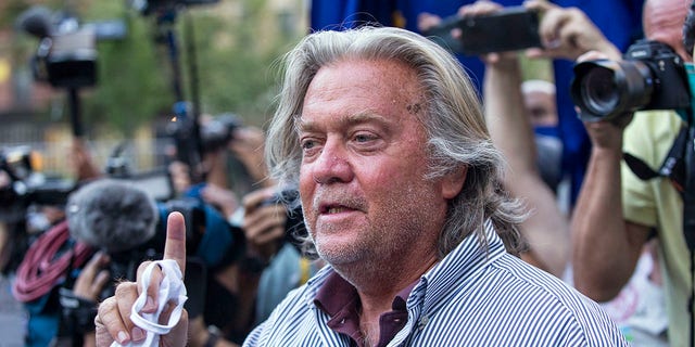 In this Aug. 20, 2020, file photo, President Donald Trump's former chief strategist, Steve Bannon, speaks with reporters in New York after pleading not guilty to charges that he ripped off donors to an online fundraising scheme to build a southern border wall. Bannon is one of those who received a pardon from Trump in the final hours of his presidency. (AP Photo/Eduardo Munoz Alvarez, File)