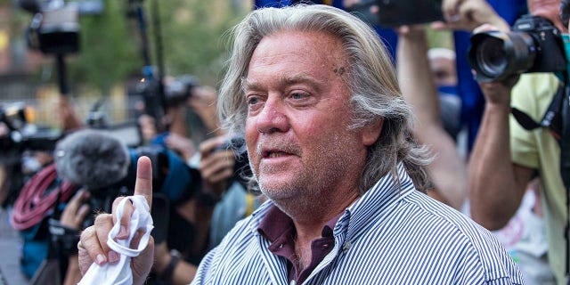 In this Aug. 20, 2020, file photo, President Donald Trump's former chief strategist, Steve Bannon, speaks with reporters in New York after pleading not guilty to charges that he ripped off donors to an online fundraising scheme to build a southern border wall. Bannon is one of those who received a pardon from Trump in the final hours of his presidency. (AP Photo/Eduardo Munoz Alvarez, File)