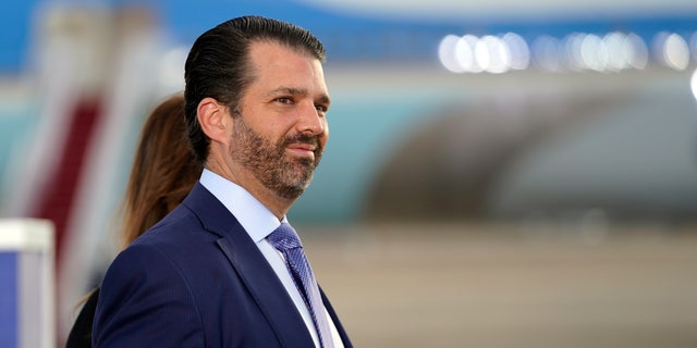 Donald Trump Jr. waits for President Donald Trump and first lady Melania Trump to arrive and board Air Force One for a final time at Andrews Air Force Base, Md., Wednesday, Jan. 20, 2021. Trump Jr. last week joined a rally against Rep. Liz Cheney, R-Wyo., by phone. (AP Photo/Manuel Balce Ceneta)