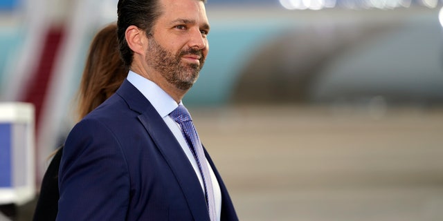 Donald Trump Jr. waits for President Donald Trump and first lady Melania Trump to arrive and board Air Force One for a final time at Andrews Air Force Base, Md., Wednesday, Jan. 20, 2021. Trump Jr. last week joined a rally against Rep. Liz Cheney, R-Wyo., by phone. (AP Photo/Manuel Balce Ceneta)