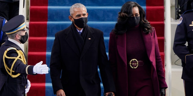 Former President Barack Obama and his wife Michelle arrive for the 59th Presidential Inauguration at the U.S. Capitol for President-elect Joe Biden in Washington, Wednesday, Jan. 20, 2021. (AP Photo/Patrick Semansky)