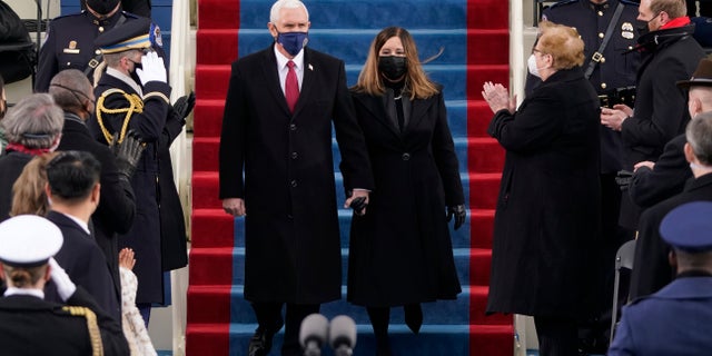 Vice President Mike Pence and his wife Karen, arrive for the 59th Presidential Inauguration at the U.S. Capitol for President-elect Joe Biden in Washington, Wednesday, Jan. 20, 2021. (AP Photo/Patrick Semansky, Pool)
