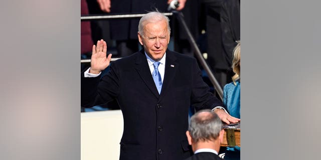 Joe Biden is sworn in as the 46th president of the United States by Chief Justice John Roberts as Jill Biden holds the Bible during the 59th Presidential Inauguration at the U.S. Capitol in Washington, Wednesday, Jan. 20, 2021.(Saul Loeb/Pool Photo via AP)