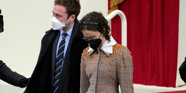 Cole and Ella Emhoff arrive during the 59th Presidential Inauguration at the U.S. Capitol in Washington, Wednesday, Jan. 20, 2021. (AP Photo/Andrew Harnik)