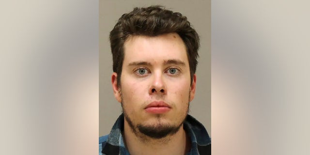 In a photo provided by the Kent County Sheriff, Ty Garbin is shown in a booking photo. Garbin, one of six men accused of conspiring to kidnap Michigan Gov. Gretchen Whitmer is returning to court next week for a likely plea deal with prosecutors. Garbin is scheduled for a change-of-plea hearing Wednesday, according to a court filing. (Kent County Sheriff via AP File)