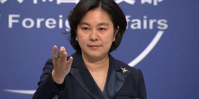 In this Jan. 20, 2021, file photo, Chinese Foreign Ministry spokesperson Hua Chunying speaks during the daily press briefing at the Foreign Ministry in Beijing. China is trying to spread doubt about the effectiveness of Western vaccines and the origin of the coronavirus as a World Health Organization-selected team of scientists are in the city where the pandemic first broke out. (AP Photo/Liu Zheng, File)