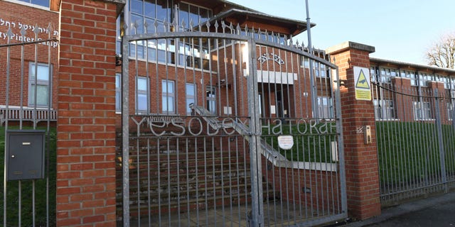 The Yesodey Hatorah Secondary Girls School in the Stamford Hill neighborhood of London is pictured. Police said that they broke up a wedding attended by 150 people despite a nationwide lockdown at the school Thursday night. (Stefan Rousseau/PA via AP, File)