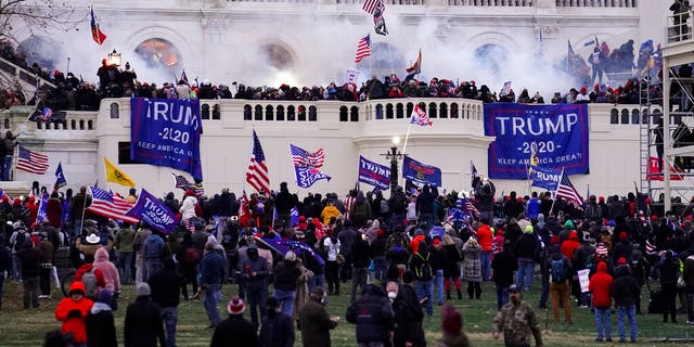 In this Jan. 6, 2021, file photo, violent rioters, loyal to President Donald Trump, storm the Capitol in Washington. (AP Photo/John Minchillo, File)