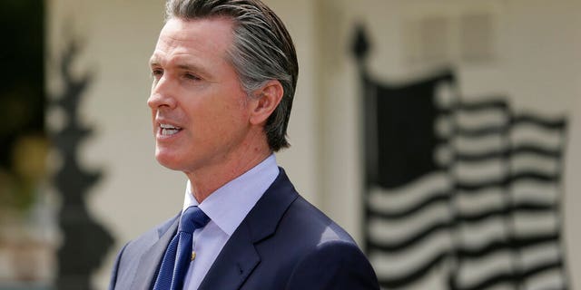 FILE: California Governor Gavin Newsom speaks during a press conference at the Veterans Home of California in Yountville, California. 