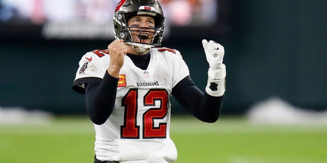 Tampa Bay Buccaneers quarterback Tom Brady reacts after winning the NFC championship NFL football game against the Green Bay Packers in Green Bay, Wis., Sunday, Jan. 24, 2021. The Buccaneers defeated the Packers 31-26 to advance to the Super Bowl. (AP Photo/Matt Ludtke)