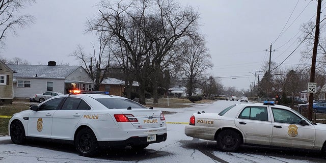 The Indianapolis Metropolitan Police Department is working on the scene Sunday, January 24, 2021 in Indianapolis where five people, including a pregnant woman, were gunned down Sunday morning at a house in Indianapolis.  (Justin L. Mack / The Indianapolis Star via AP)