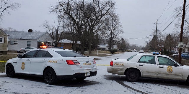 Indianapolis Metropolitan Police Department work the scene Sunday, Jan. 24, 2021 in Indianapolis where five people, including a pregnant woman, were shot to death early Sunday inside an Indianapolis home. (Justin L. Mack/The Indianapolis Star via AP)