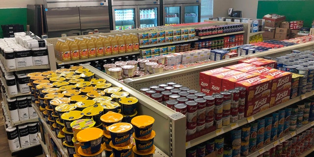 Food and toiletries line the shelves of Linda Tutt High School's student-led grocery store on Nov. 20, 2020, in Sanger, Texas. (Anthony Love via AP)