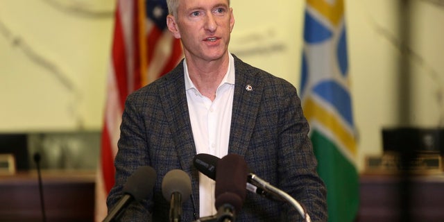 In this August 30, 2020 file photo, Portland Mayor Ted Wheeler speaks at a press conference.  On Monday it was revealed that he had sprayed pepper on a man who confronted him outside a pub over the weekend about not wearing a mask during dinner.  (Sean Meagher / The Oregonian via AP, file)