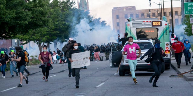 FILE: Detroit police fire tear gas at protesters during the third day of protesting police brutality and justice for George Floyd in Detroit. 