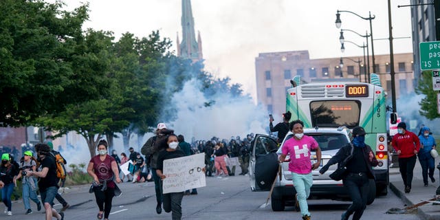 FILE: Detroit police fire tear gas at protesters during the third day of protesting police brutality and justice for George Floyd in Detroit.
