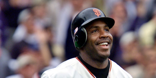 San Francisco Giants' Barry Bonds smiles as he begins to round the bases after he hit his 73rd home run of the season, against the Los Angeles Dodgers in a baseball game in San Francisco on Oct. 7, 2001.  (AP Photo/Eric Risberg, File)