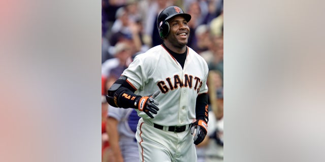 Barry Bonds of the San Francisco Giants smiles as he begins to round the bases after hitting his 73rd home run of the season against the Los Angeles Dodgers in San Francisco