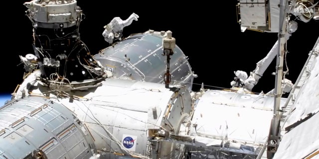 In this image taken from NASA video, NASA astronaut Mike Hopkins works outside the International Space Station’s European lab on Wednesday, Jan. 27, 2021. (NASA via AP)
