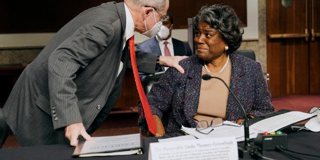 Sen. James Risch, R-Idaho, left, greets United States Ambassador to the United Nations nominee Linda Thomas-Greenfield before her confirmation hearing before the Senate Foreign Relations Committee on Capitol Hill, Wednesday, Jan. 27, 2021, in Washington. (Greg Nash/Pool via AP)