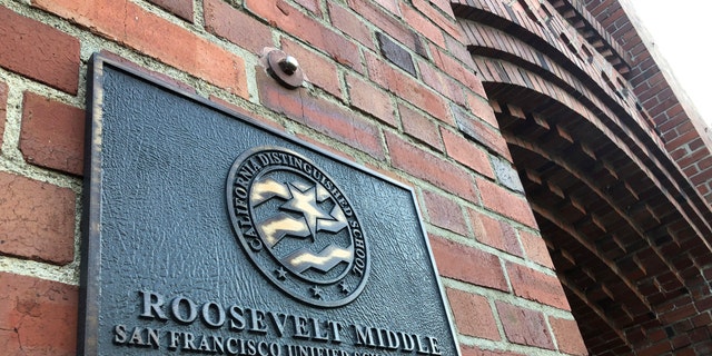 A plaque for Roosevelt Middle School is seen outside the school in San Francisco, on Wednesday, Jan. 27, 2021. (AP Photo/Haven Daley)