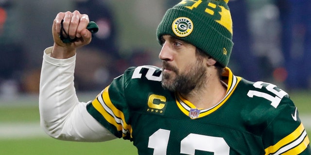 Green Bay Packers quarterback Aaron Rodgers pumps his fist after an NFL Division playoff soccer game against the Los Angeles Rams on Saturday, Jan.16, 2021, in Green Bay, Wisconsin.  The Packers beat the Rams 32-18 to advance to the NFC Championship game.  .  (AP Photo / Mike Roemer)