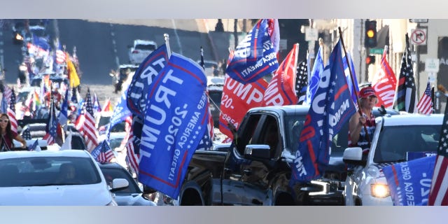 Trump supporters caravan along the Rose Parade route on Colorado Boulevard on Jan. 1, 2021, in Pasadena, California. (Keith Birmingham/MediaNews Group/Pasadena Star-News via Getty Images)