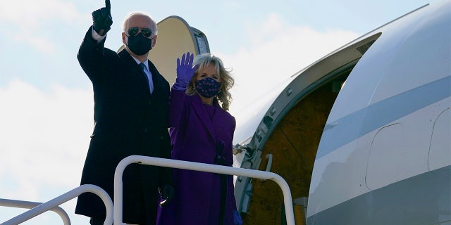 President-elect Joe Biden and his wife Jill Biden board a plane at New Castle Airport, Tuesday, Jan. 19, 2021, in New Castle, Del. (AP Photo/Evan Vucci)