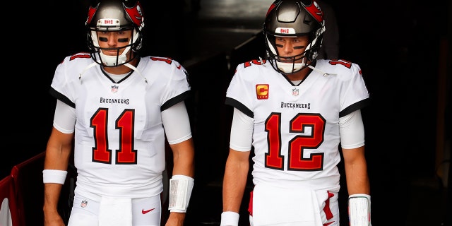 Tom Brady #12 of the Tampa Bay Buccaneers and Blaine Gabbert #11 of the Tampa Bay Buccaneers enter the field before the start of a game against the Los Angeles Chargers at Raymond James Stadium on Oct. 4, 2020 in Tampa, Florida.