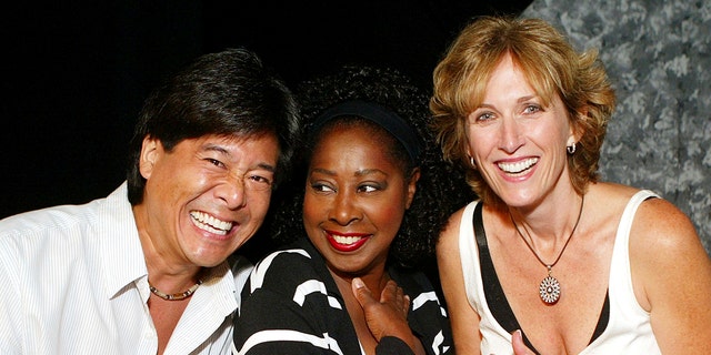 Marion Ramsey (center) with fellow 'Police Academy' franchise alums Brian Tochi (left) and Kathryn Graf (right). (Photo by Kevin Winter/Getty Images)
