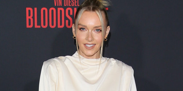 Camille Kostek posed in a Tampa Bay Buccaneers jersey with the number 87, which is worn by Gronkowski. (Photo by Jean Baptiste Lacroix/WireImage)