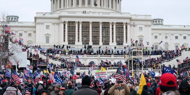 Trump supporters gather outside the Capitol, Wednesday, Jan. 6, 2021, in Washington. (AP Photo/Jose Luis Magana)