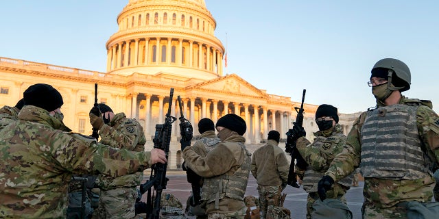 WASHINGTON, DC - JANUARY 13: Weapons are distributed to members of the National Guard outside the U.S. Capitol on January 13, 2021 in Washington, DC. Security has been increased throughout Washington following the breach of the U.S. Capitol last Wednesday, and leading up to the Presidential inauguration. (Photo by Stefani Reynolds/Getty Images)