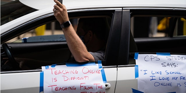 Chicago Teachers Union members and supporters join a car caravan outside Chicago Public Schools headquarters while a Chicago Board of Education meeting takes place inside in Chicago on July 22, 2020. (Photo by Max Herman/NurPhoto via Getty Images)
