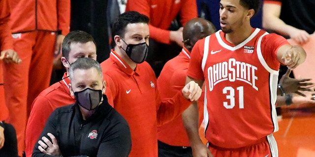 Ohio State Head Coach Chris Holtmann looks on from the sideline in the first half of an NCAA college basketball game against Illinois, Saturday, Jan. 16, 2021, in Champaign, Ill. (AP Photo/Holly Hart)