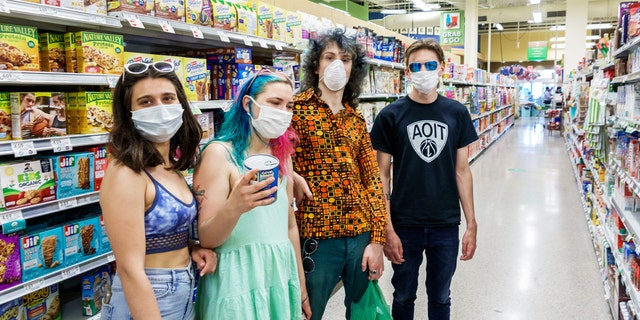 Miami Beach, Teens in face masks shopping at Publix grocery store. (Photo by: Jeffrey Greenberg/Education Images/Universal Images Group via Getty Images)