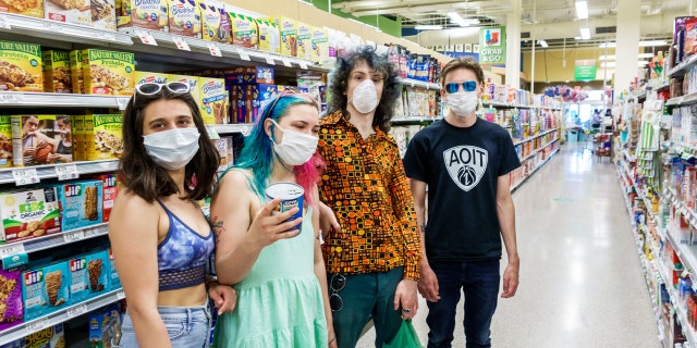 Miami Beach, Teens in face masks shopping at Publix, grocery store. (Photo by: Jeffrey Greenberg/Education Images/Universal Images Group via Getty Images)