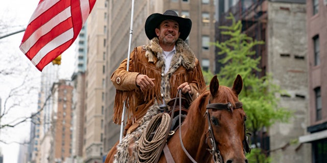NEW YORK, NY - MAY 01: Otero County Commission Chairman and Cowboys for Trump co-founder Couy Griffin rides his horse on 5th avenue on May 1, 2020 in New York City. (Photo by Jeenah Moon/Getty Images)
