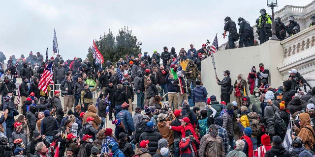 Protesters seen all over Capitol building where pro-Trump supporters riot and breached the Capitol. Rioters broke windows and breached the Capitol building in an attempt to overthrow the results of the 2020 election. Police used batons and tear gas grenades to eventually disperse the crowd. Rioters used metal bars and tear gas as well against the police. (Photo by Lev Radin/Pacific Press/LightRocket via Getty Images)